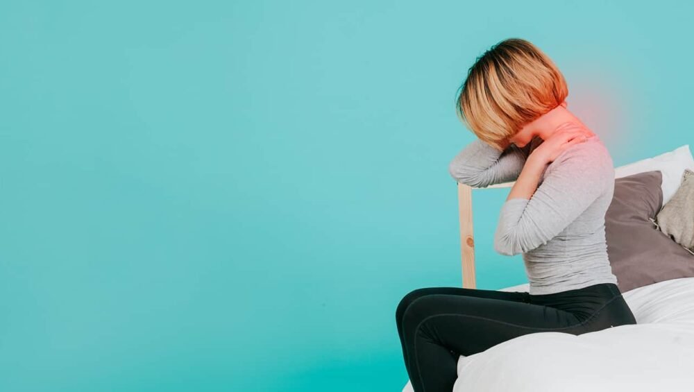 a young girl suffering from severe neck pain