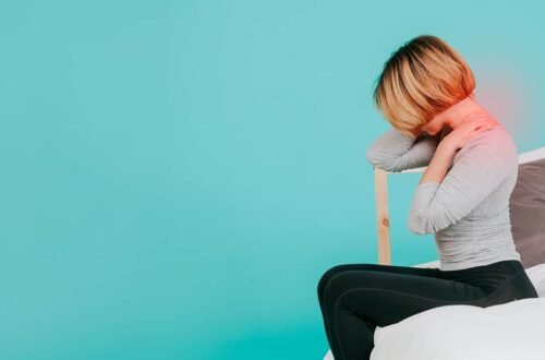 a young girl suffering from severe neck pain